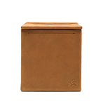 Tissue Box in Tobacco leather, straight-on side view of the empty box with embossed pig logo