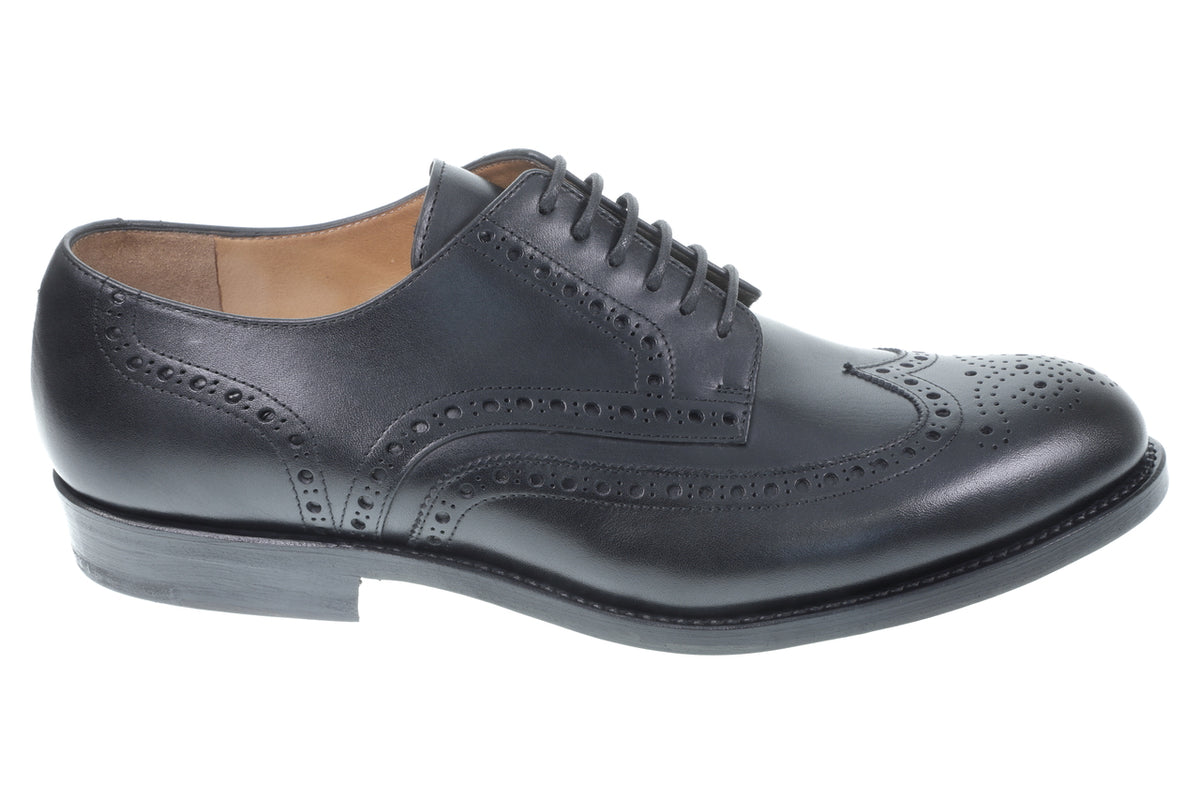Wingtip Shoes in Raven Black, outer side profile of a single shoe on white