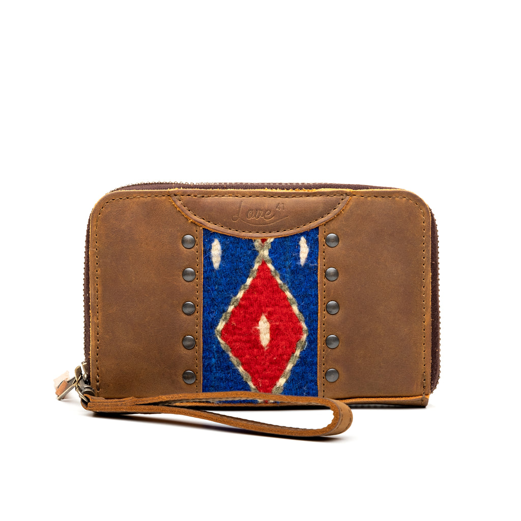 Lanita Thin Wallet in Tobacco, front view with woven diamond panel, studs and wrist strap