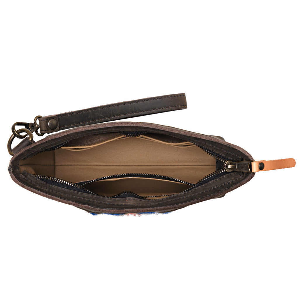 Lanita Leather Clutch in charcoal gray, top-down view of empty unzipped interior with wrist strap