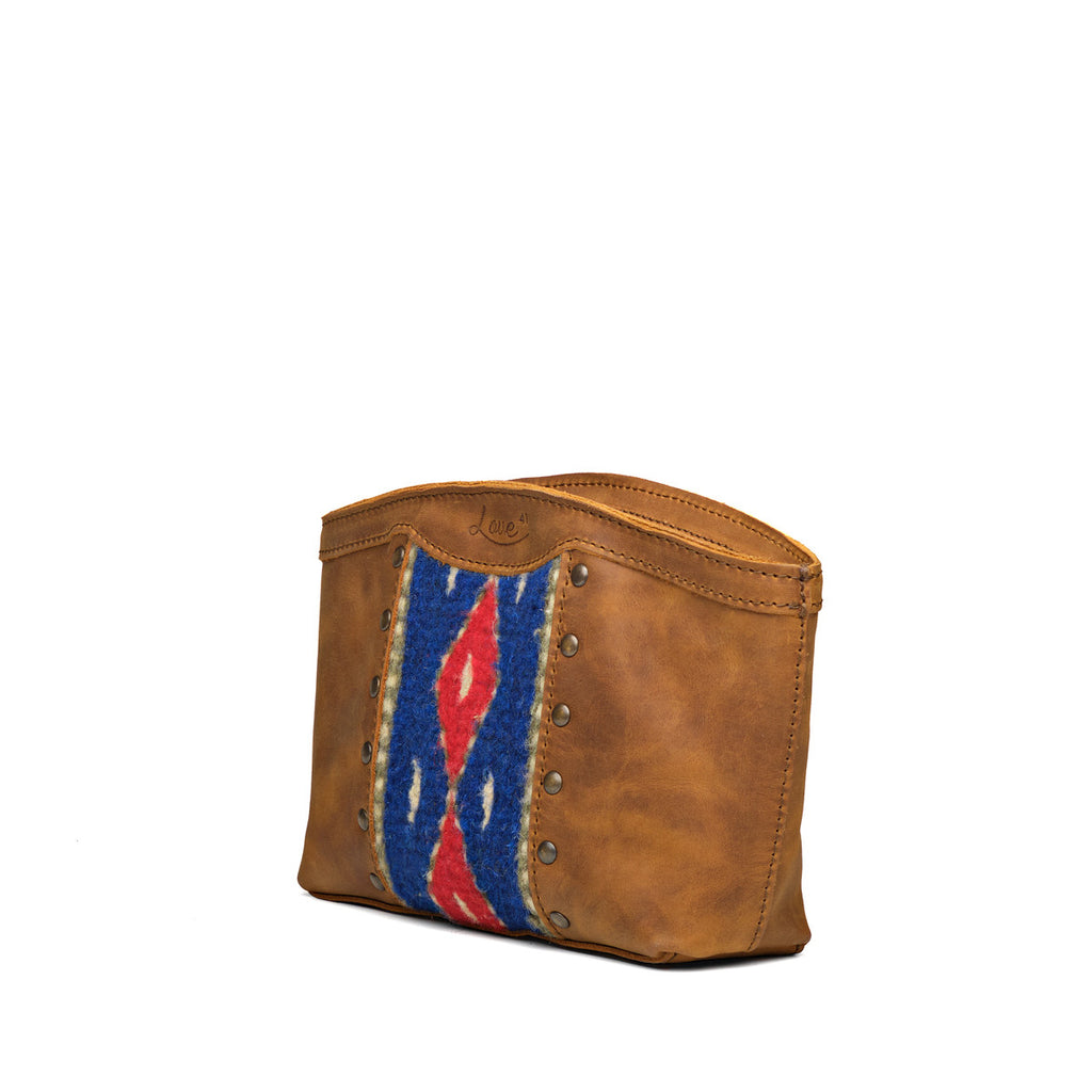 Lanita Leather Clutch in Tobacco, angled front view with woven panel and studs