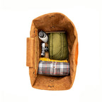 20" Waterbag in Clay, top-down view packed with a jacket, flannel blanket, bottle and camera