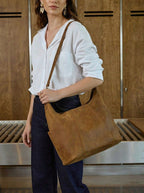 Woman wearing the Women's Hobo Organizer Bag in Tobacco on her shoulder