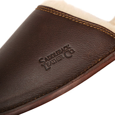 Women's Sheepskin Slipper in Dark Coffee Brown, close-up of the embossed logo on the side