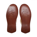 Women's Sheepskin Slippers, bottom view of the stamped leather soles