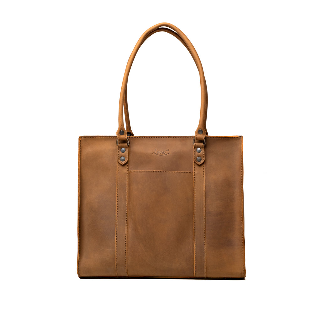 Women's Work Tote in Tobacco, front view showing slip pocket and embossed logo