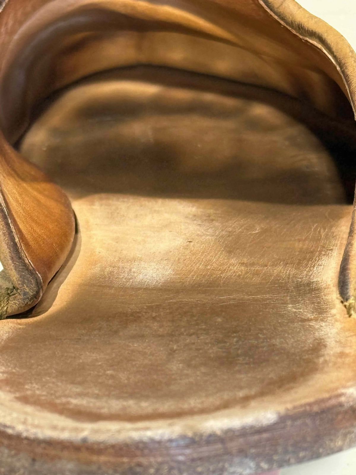 Close-up of the flat leather footbed inside a barefoot shoe with no arch support