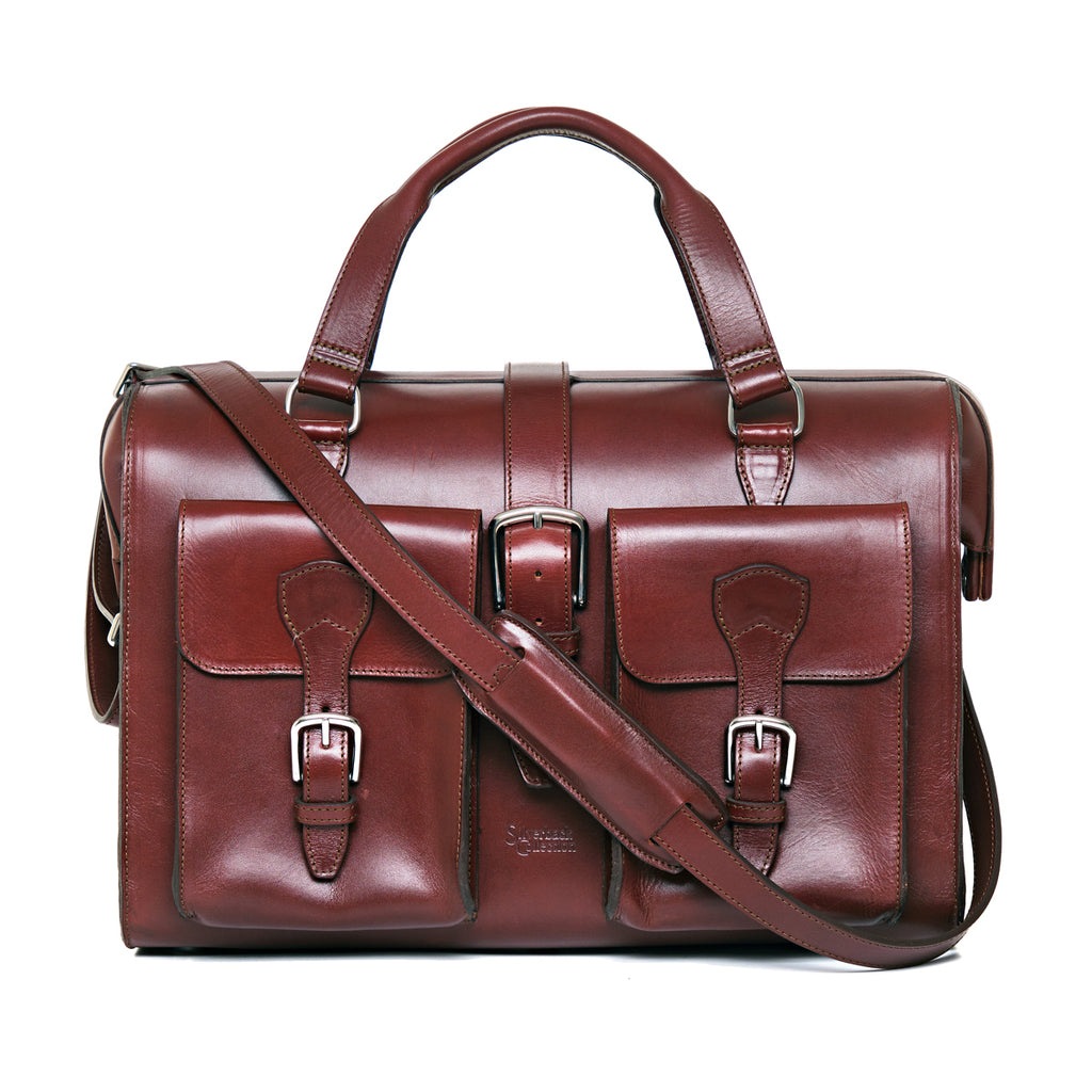 Blackstone Barrister Briefcase in Oxblood, front view with two buckled pockets and shoulder strap