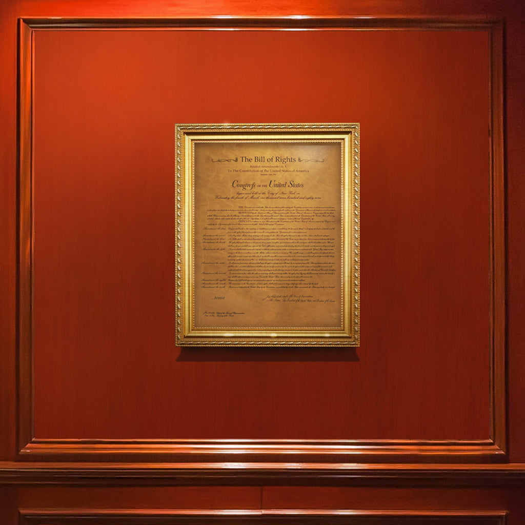 Leather Bill of Rights in a gold frame, displayed on a red wood paneled wall