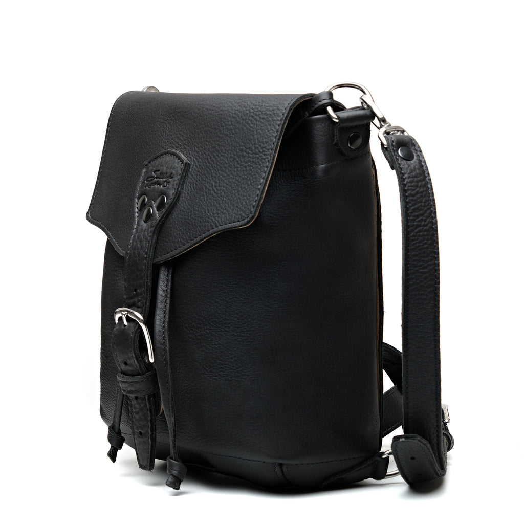 10" Convertible Crossbody in Black, angled front view with buckled flap and strap