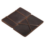 Large Magic Wallet in Dark Coffee Brown opened flat to show the crossed leather straps inside
