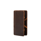 Large Magic Wallet in Dark Coffee Brown standing upright and closed, showing the tall slim profile and side straps