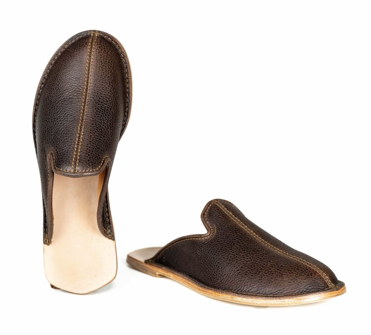 Brown leather barefoot mule slip-on shoes, top and side view showing the natural leather sole