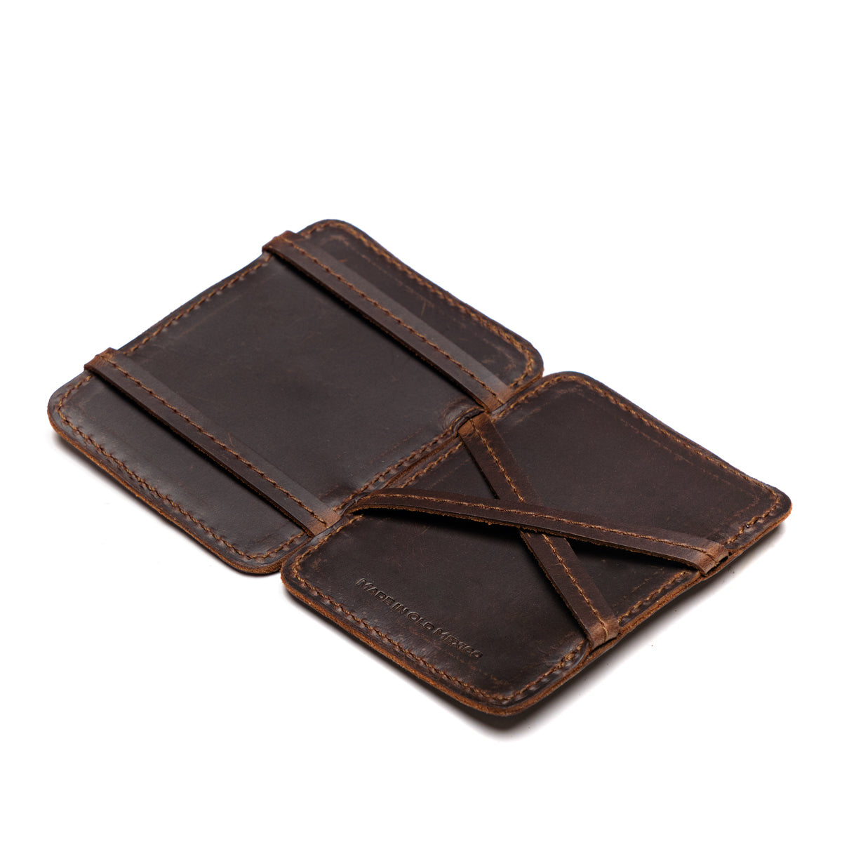 Front Pocket Magic Wallet in Dark Coffee Brown opened flat to show the crossed leather straps inside