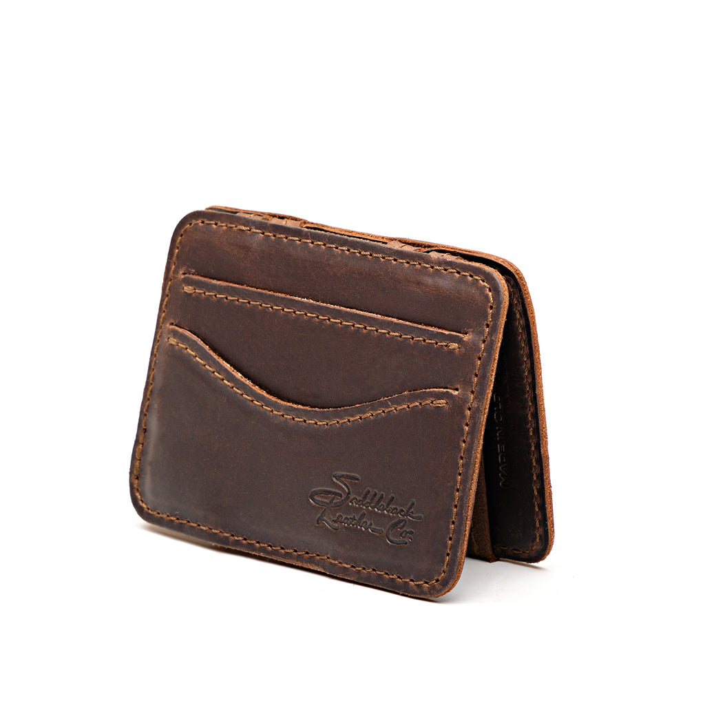 Front Pocket Magic Wallet in Dark Coffee Brown, angled view with curved card pockets and embossed logo