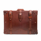 Grandfather Medium Suitcase in Chestnut, front view with three buckle straps and riveted corner caps