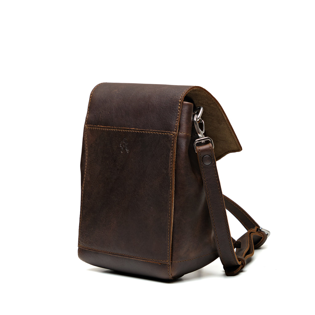 Mini Bucket Bag in Dark Coffee Brown, angled back view with strap and slip pocket