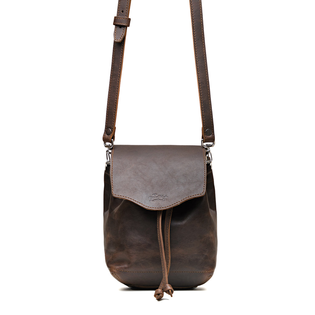Mini Bucket Bag in Dark Coffee Brown, front view with flap, drawstring tie and adjustable crossbody strap