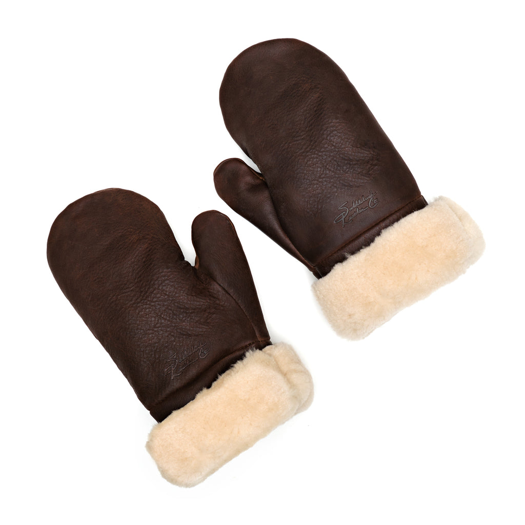 Sheepskin Mittens in dark brown leather with cream shearling cuffs, pair laid flat, top view