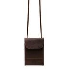 Walker's Pouch in dark brown, front view with flap closure and long crossbody strap