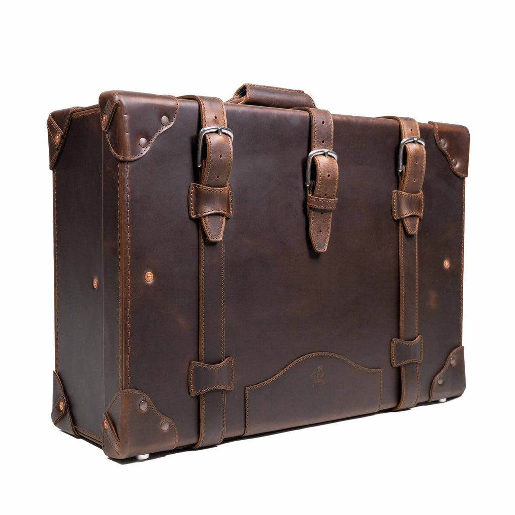 Grandfather Medium Suitcase in Dark Coffee Brown, angled front view with three buckle straps and top handle
