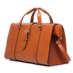 Taylor Duffle Bag in English Tan, three-quarter side view with buckle strap and shoulder strap