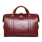 Taylor Duffle Bag in Oxblood, back view with top handles and snap tab