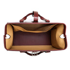 Taylor Duffle Bag in Oxblood, top view of the open interior with tan lining