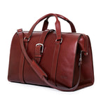 Taylor Duffle Bag in Oxblood, three-quarter side view with buckle strap and shoulder strap