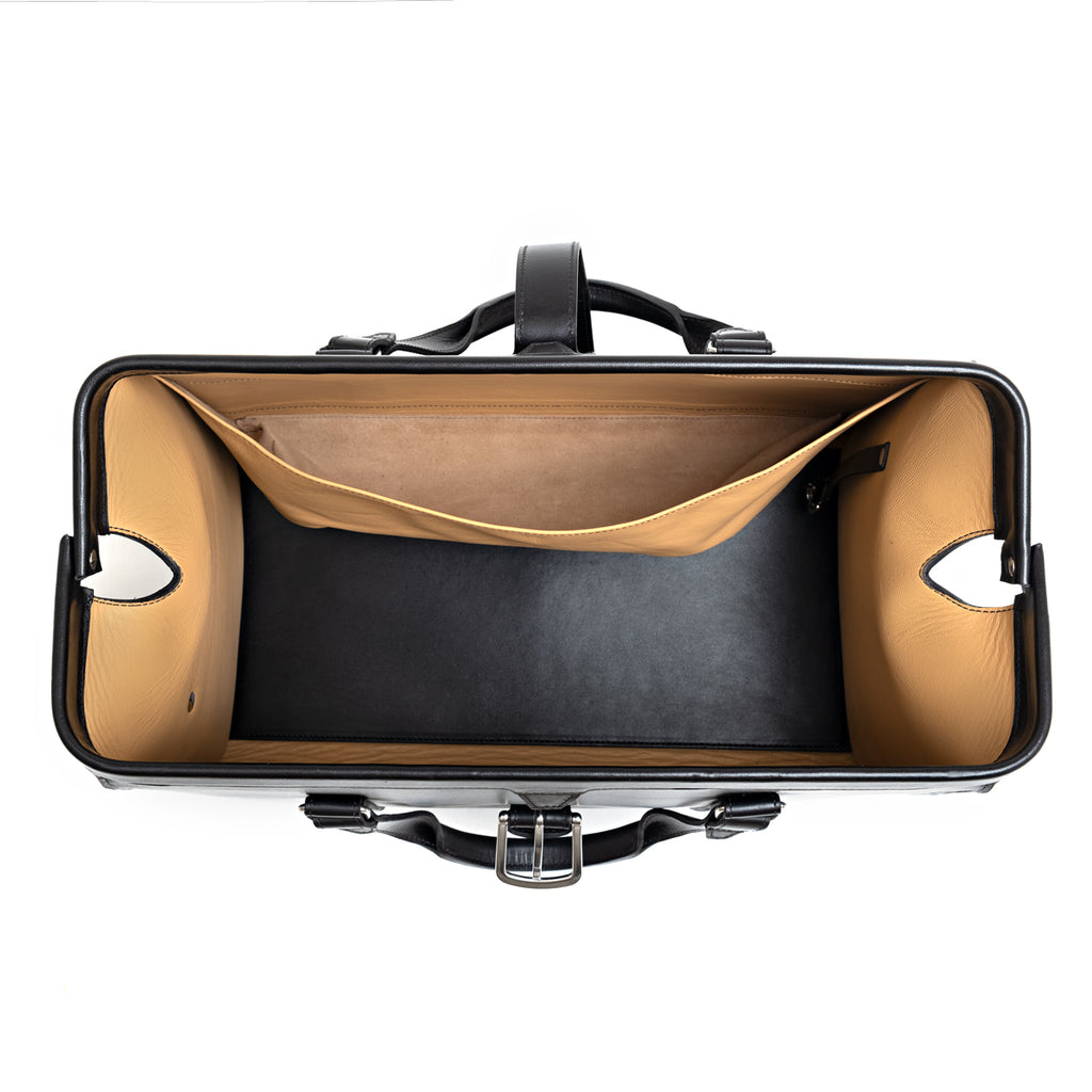 Taylor Duffle Bag in Raven Black, top view of the open interior with tan lining