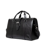 Taylor Duffle Bag in Raven Black, three-quarter side view with buckle strap and clip hardware