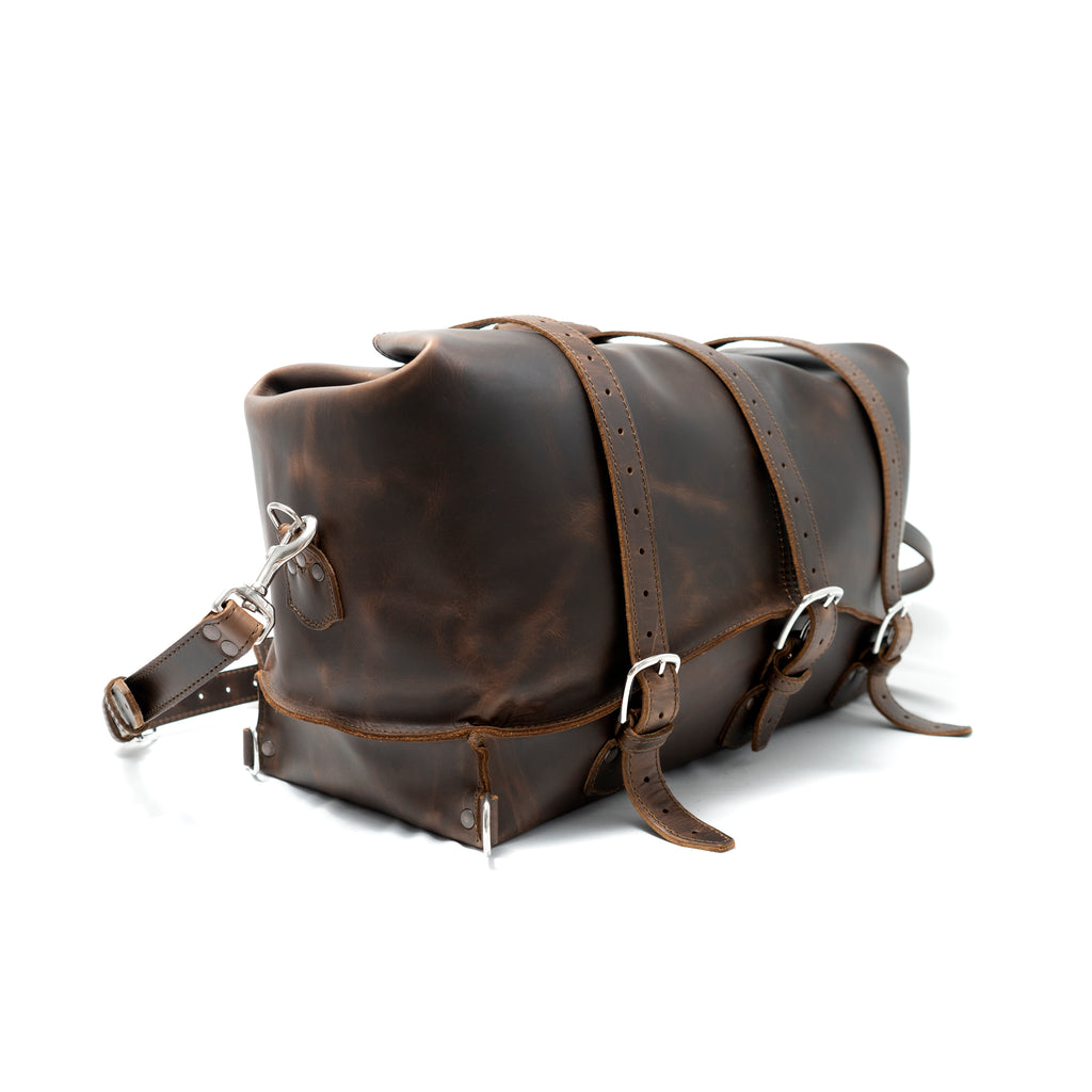 20" Waterbag in Dark Coffee Brown, angled side view with buckle straps and shoulder strap