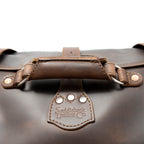 20" Waterbag in Dark Coffee Brown, close-up of top handle and riveted Saddleback Leather Co. tab