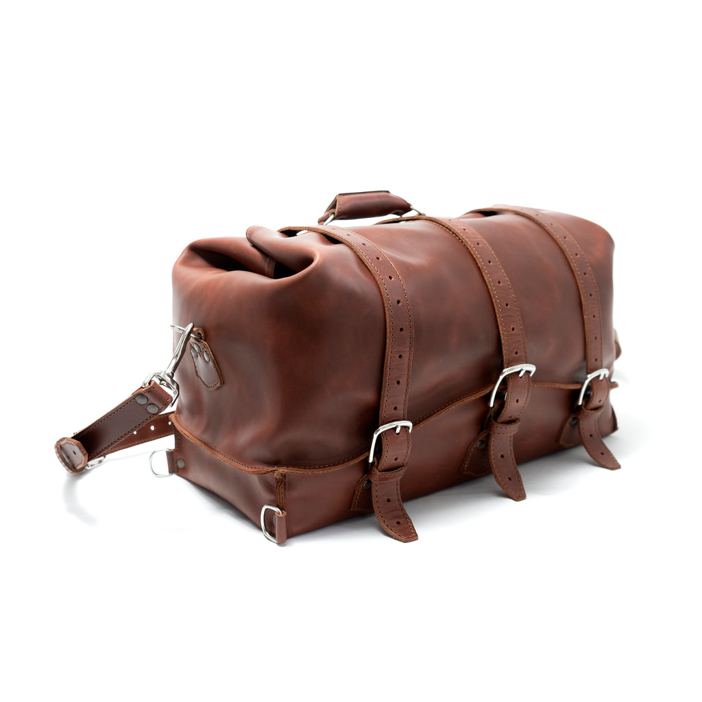 20" Waterbag in Chestnut, angled side view with buckle straps and shoulder strap