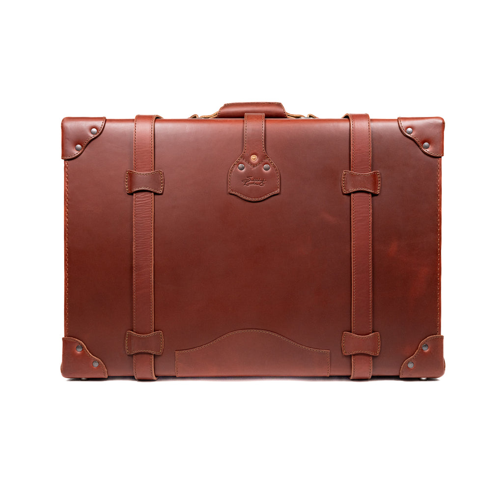 Grandfather Suitcase in Chestnut, back view with top handle, leather straps and riveted corners