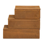 Small Organizer Box in Tobacco stacked on two larger Tobacco leather boxes, each with embossed logo