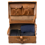 Grandfather Overnight Case in Tobacco, open showing lid pockets and packed folded sweaters