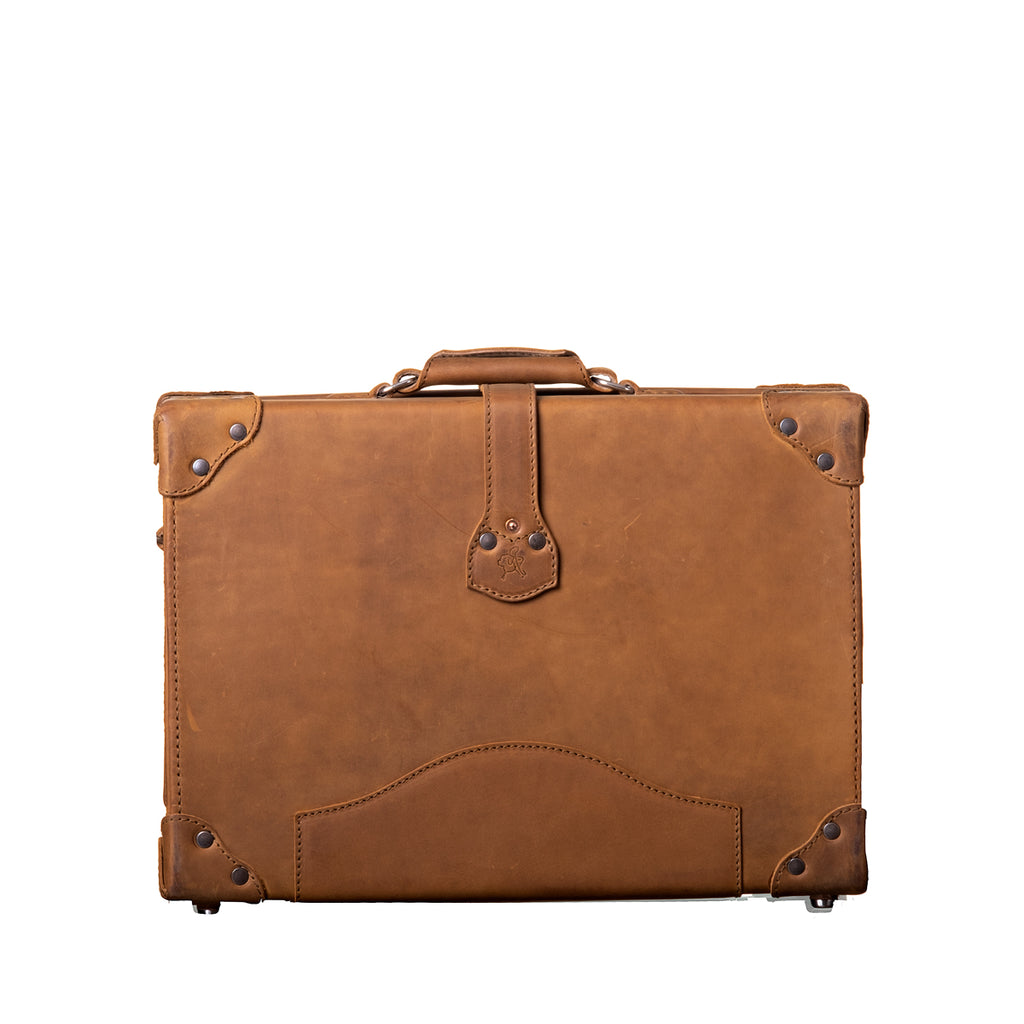 Grandfather Overnight Case in Tobacco, back view with top handle, riveted strap tab and metal corner caps