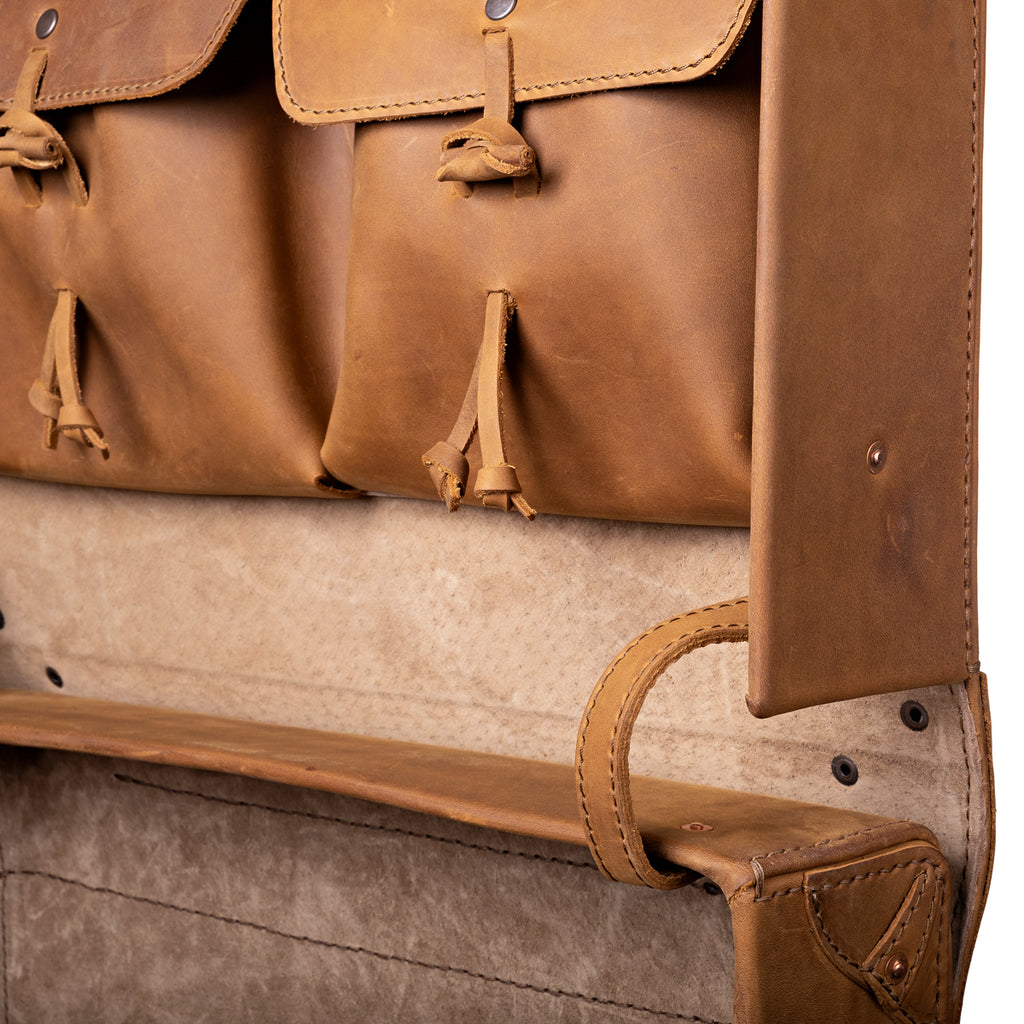 Grandfather Overnight Case in Tobacco, close-up of the open lid pockets with toggle ties and the lid stay strap
