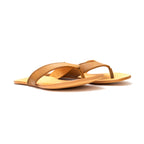 Pair of Flip Flops in Tobacco leather with natural footbeds, low side angle view