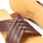 Martha Sandals in Chestnut, close-up of woven straps and stamped logo on the sole