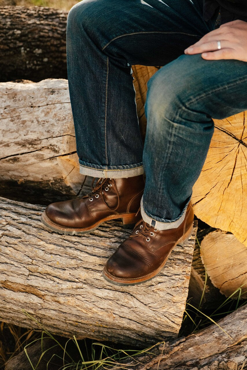 High-quality dark brown boots showing on a model