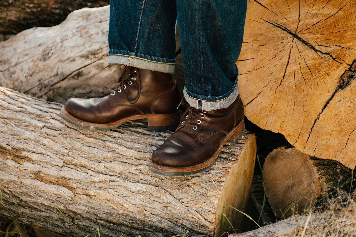 High-quality dark brown boots showing on a model