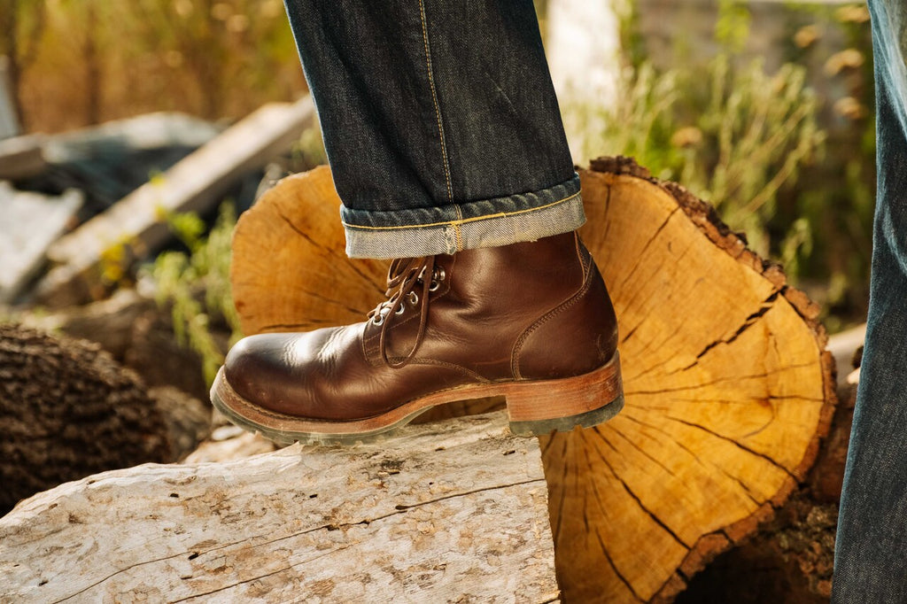 High-quality dark brown boots showing on a model