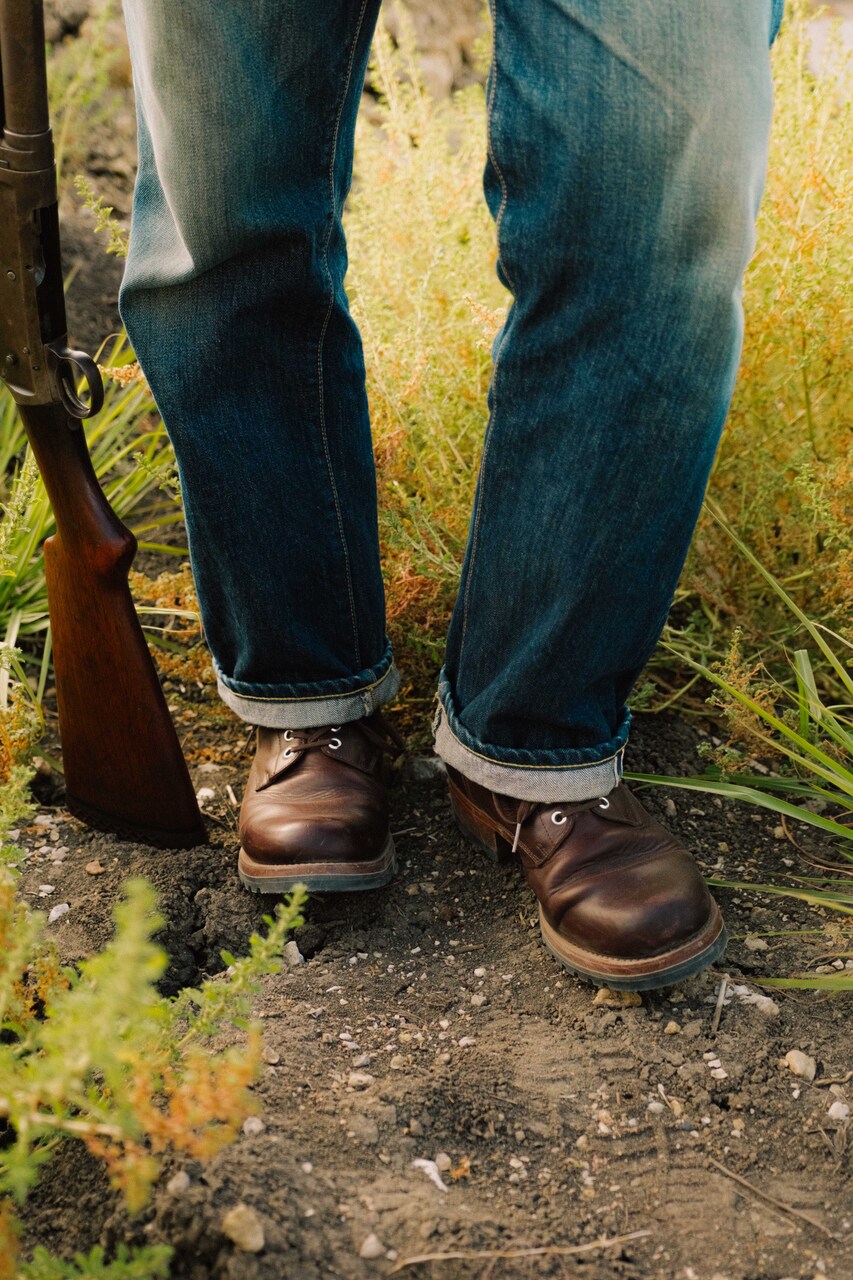 High-quality dark brown boots showing on a model
