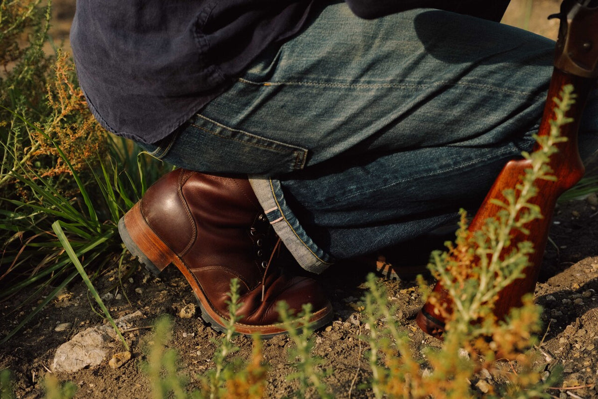 High-quality dark brown boots showing on a model