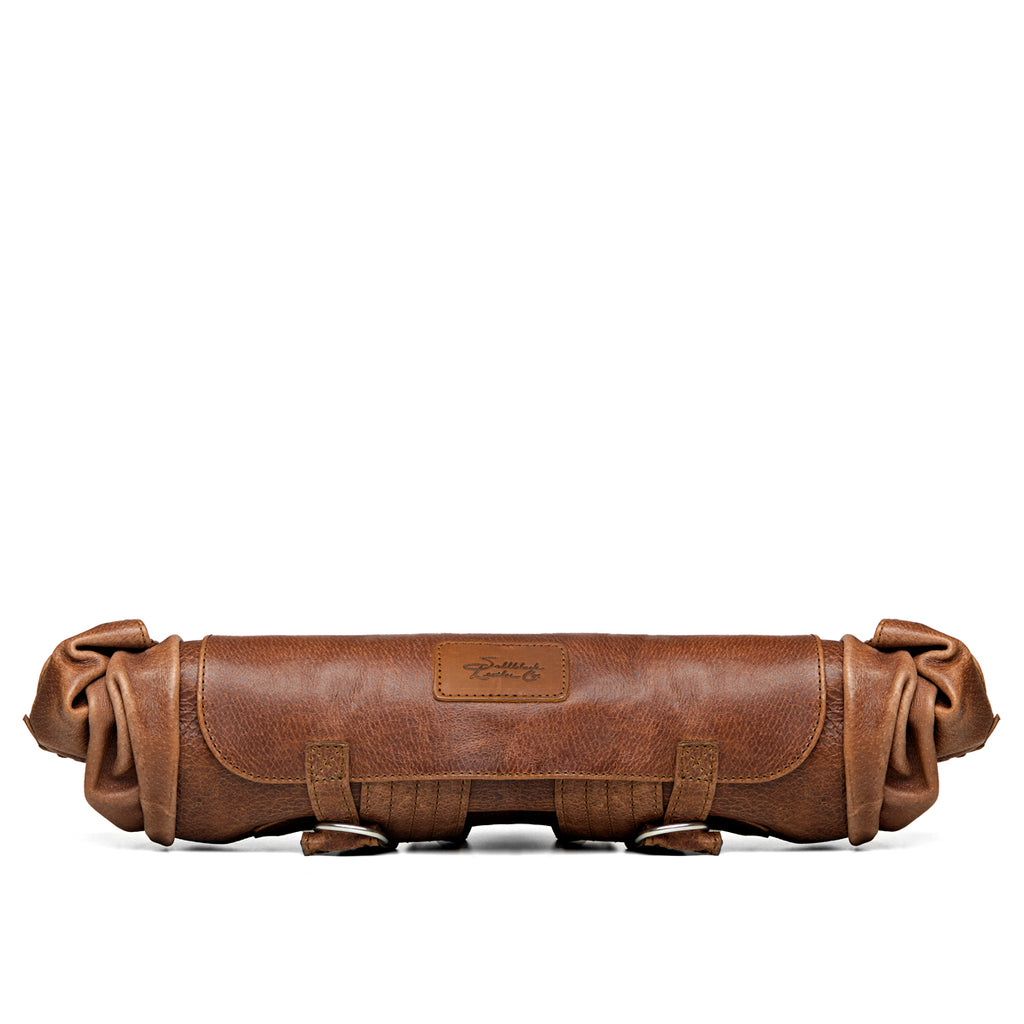 Large Travel Backpack in Burnt Sausage, rolled up flat for storage, side view
