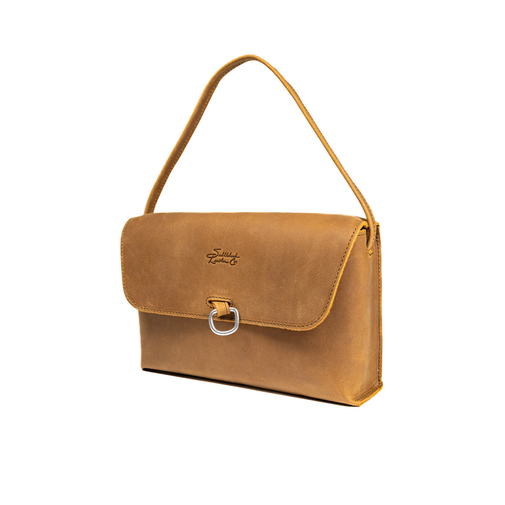 Large Leather Organizer Bag in Tobacco, angled view with tie looped up as a carry handle and metal ring on the flap