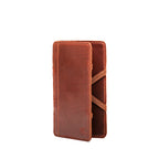 Large Magic Wallet in Chestnut standing upright and closed, showing the tall slim profile and side straps