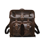 Big Mouth Leather Backpack in Dark Coffee Brown, front view with buckled pockets and top handle